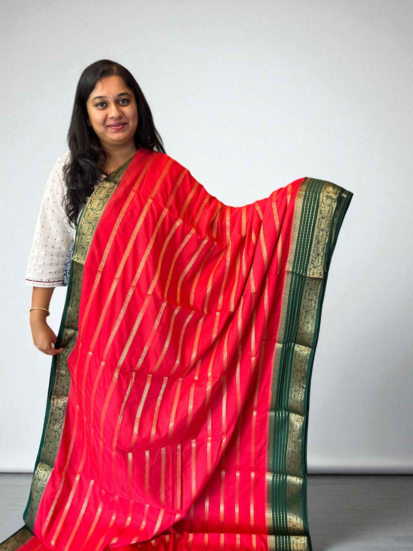 Premium Georgette Saree in Tomato Red with Bottle Green Accents - Craft Of Aele