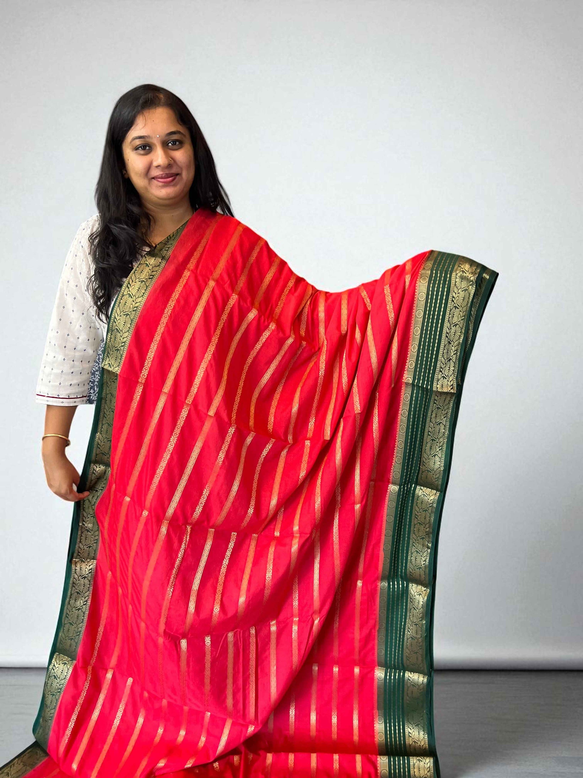 Premium Georgette Saree in Tomato Red with Bottle Green Accents - Craft Of Aele